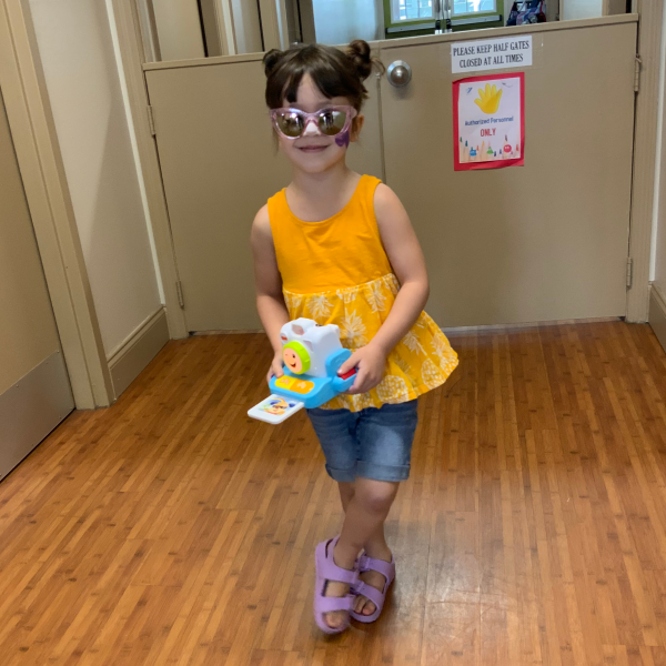 Tourist Day fun with sunglasses and a toy camera